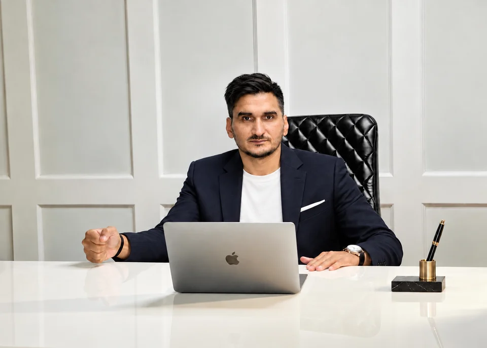 Sukhtaran Chatha seated at his desk
